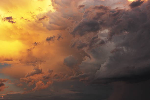 Sunset Monsoon Storm Cloud Sky "Cumulous monsoon storm clouds fill a desert summer sunset sky suggesting impending rain with thunder and lightning.  Pine Valley, Arizona, 2010." Microburst stock pictures, royalty-free photos & images