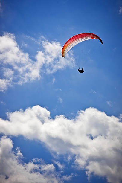 istock Paraglider upon Cloudy Blue Sky, Dolomites in Summer 182929213