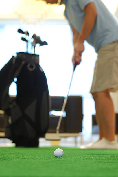 крытый гольф физические упражнения-большой x - carpet iron стоковые фото и изображения