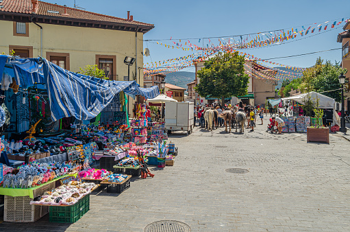 Rascafria, Spain - August 17, 2019: View of the streets in the village of Rascafria, Spain, decorated during its local feasts
