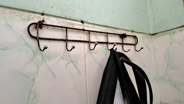 istock black trousers hanging on a wall hook 1829298793