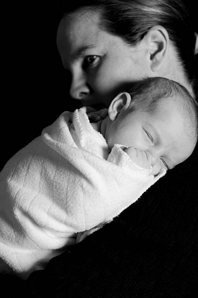 istock Sleeping Newborn On Mothers Shoulder 182930503