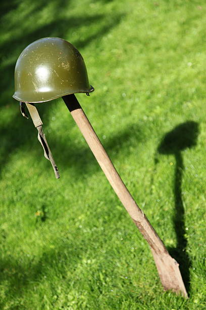 istock Retro NATO or US Army helmet put on spade 182930845