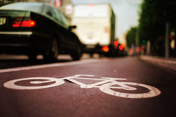 istock Bike lane and traffic 182930918