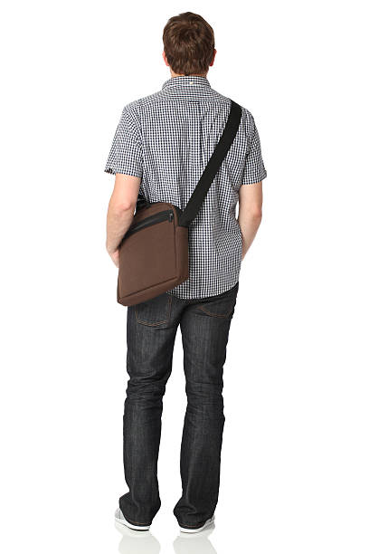 istock Rear view of man standing with shoulder bag 182930945
