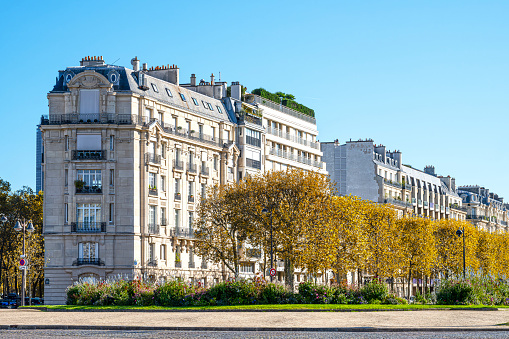 Facade of a Parisian building in autumn, in France.
