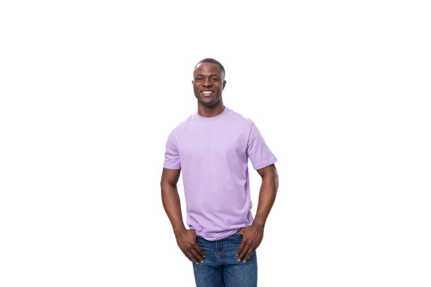 istock young charming american man dressed in a lilac t-shirt on a white background 1829386972