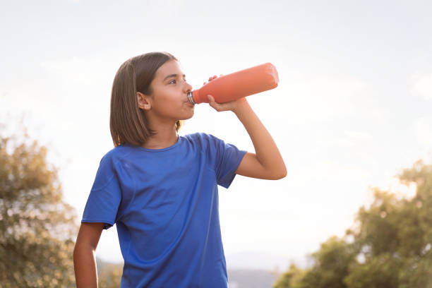 istock girl drinking water during her training 1829390248