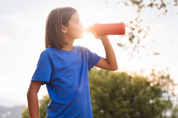 istock girl drinking water during her training 1829390288