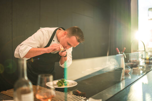 istock Young Chef's Creative Touch for a Memorable Bachelorette Dinner 1829394165