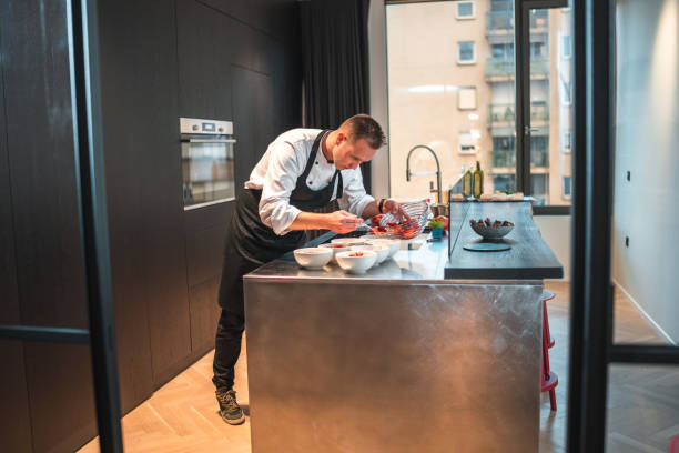 istock Professional Chef Masterfully Plating Delicious Cuisine 1829394688