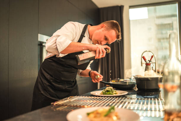 istock Young Chef's Creative Touch for a Memorable Bachelorette Dinner 1829394719
