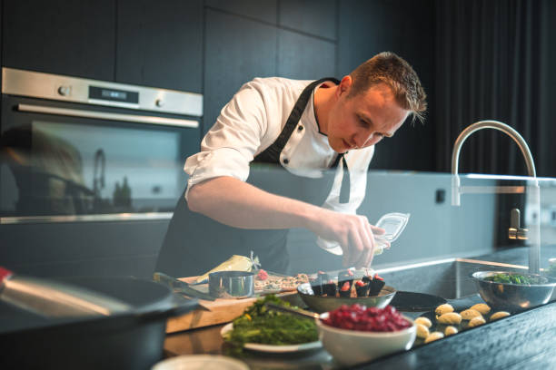 istock Precise and Skilled Chef Preparing Exquisite Dishes for Bachelorette Dinner 1829395250