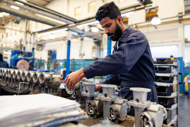 istock Man working at a water pump factory 1829438079