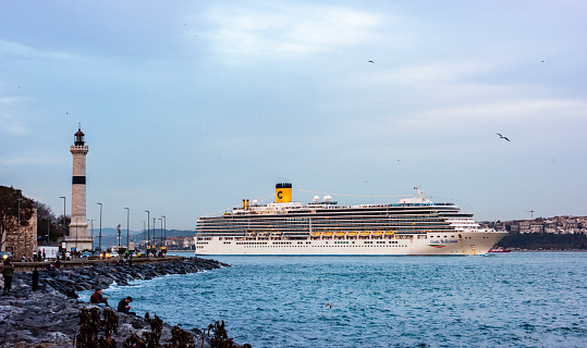 Istanbul, Turkey - December 3, 2023: Costa Deliziosa cruise ship in Istanbul, Turkey. The cruise ship is sailing in the Istanbul Bosphorus.