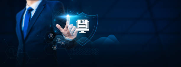 istock Businessman hand touches a shield, symbolizing protection for the Learning Management system (LMS). The concept represents safeguarding the educational platform from potential issues. 1829535407