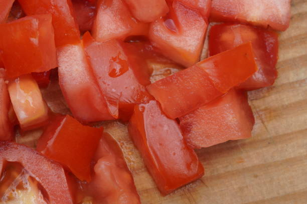 Chopped Tomatoes on wooden table
