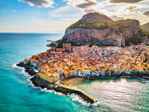 Cefalu, medieval village of Sicily island, Province of Palermo, Italy Drone view from above at the old town of Cefalu at sunset, medieval village of Sicily island, Province of Palermo, Italy. Europe. Cathedral of Cefalu cefalu stock pictures, royalty-free photos & images