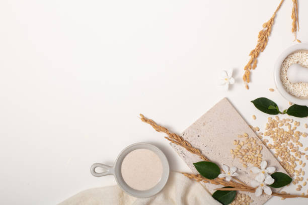 istock Rice bran and props on white background. Ideal space for displaying products with main ingredients from rice bran. Pure rice bran does not contain lactose, gluten and does not cause allergies. 1829565393