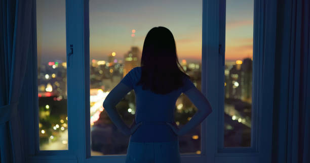 istock woman looking at city 1829567147