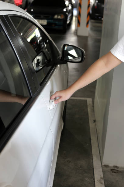 istock Male hand opening car door 1829585322