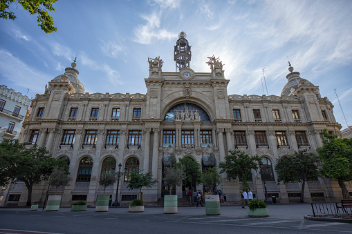 Street view of Central Post Office Building (Edificio de Correos y Telegrafos) at Plaza del Ayuntamiento or City Hall Plaza , Valencia, Spain.