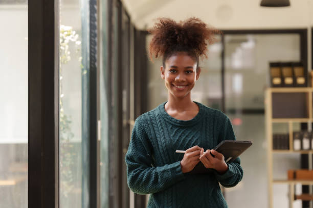 istock Woman student holding tablet preparing for online class. 1829695504