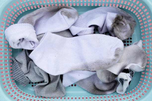 istock Dirty white socks in laundry basket 1829699926