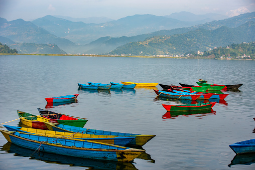 Phewa or Fewa Lake is a freshwater lake in Nepal formerly called Baidam Tal located in the Pokhara Valley, Nepal. Colorful boats floating on the Lake in the morning