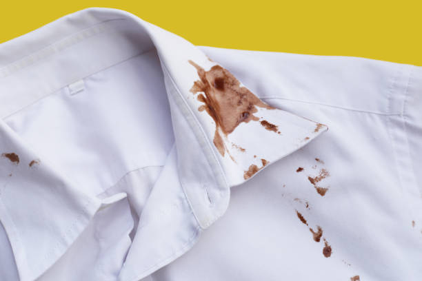 istock Dirty choclate stain on white shirt 1829720113