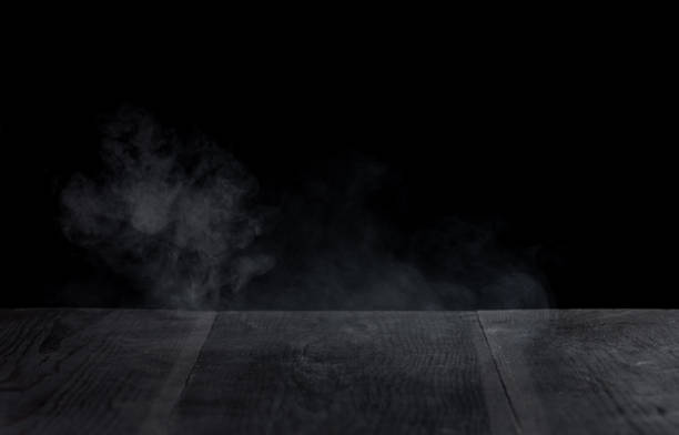 istock Fog In Darkness - Smoke And Mist On Wooden Table 1829743972