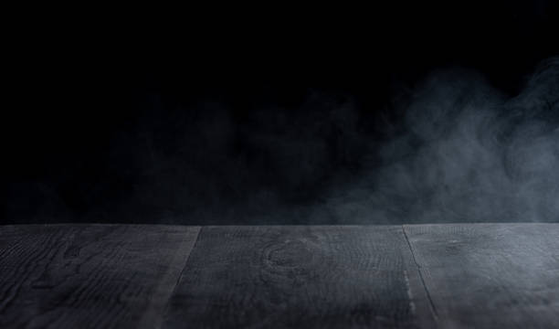 istock Fog In Darkness - Smoke And Mist On Wooden Table 1829743976