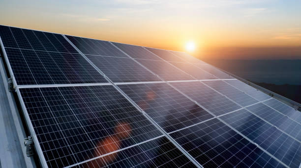 istock Solar panel against sunset sky background. Photovoltaic, alternative electricity source. Idea for sustainable resources 1829754368
