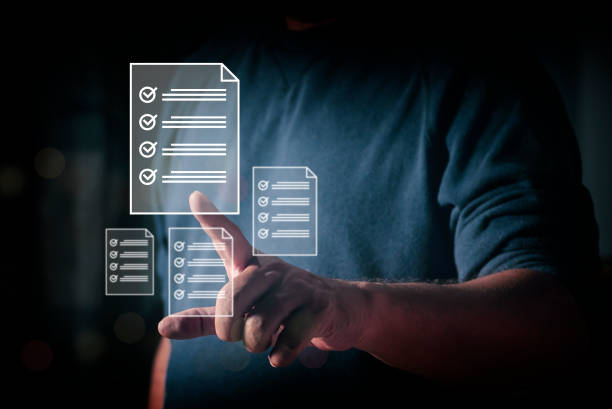 istock Developer touches virtual screen showing check mark summarizing job. surveys and quality control assessments to achieve business goals and succeed in elections and voting. 1829819427