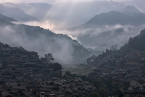 Miao village in a foggy morning in autumn, Guizhou Province, China