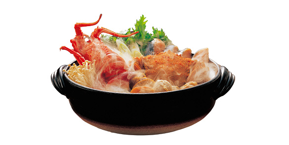 Seafood sukiyaki with salmon and albino lobster in a pot on a white background