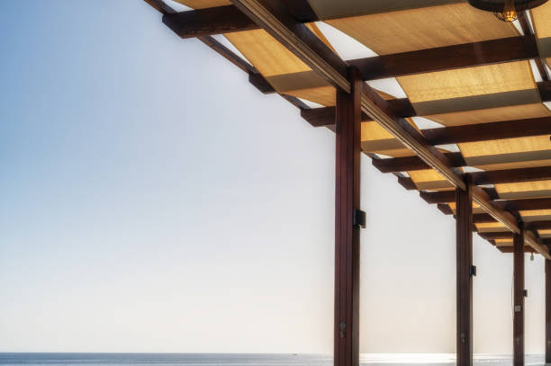 Discover the charm of coastal elegance with this stunning image of a villa terrace in Antalya, Turkey. This spacious terrace features luxurious outdoor furniture sunbeds and a shimmering swimming pool, creating an inviting space for relaxation and socializing. With its emphasis on open space and natural materials, the terrace offers breathtaking views of the sparkling sea in the background. The harmonious palette of white and blue enhances the serene atmosphere, making it the perfect setting for leisurely moments. Ideal for showcasing high-end outdoor living designs or promoting luxury real estate, this image embodies the essence of sophisticated coastal living.