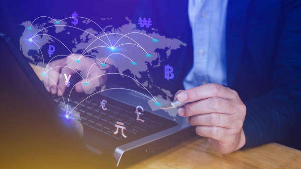 istock Businessman using mobile phone and laptop computer to money transfers and currency exchanges between countries of the world, online banking interbank payment concept. 1829843481