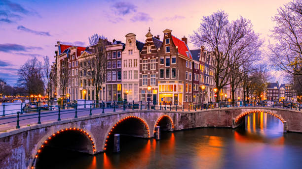 istock Amsterdam Netherlands canals with lights during evening in December during winter in the Netherlands 1829847695