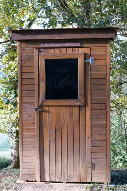 istock Small wooden cabin in garden. 1829850844