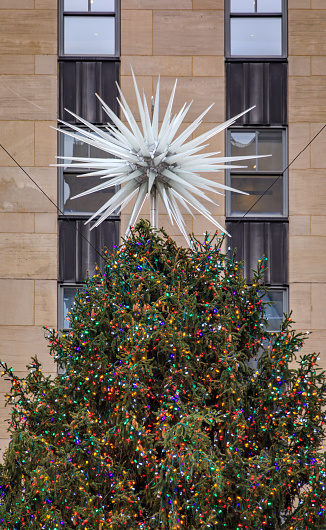 New York, USA - December 01, 2023: Christmas tree topper at the famous Rockefeller Center, holiday attraction on Fifth Avenue, Midtown Manhattan