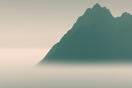 Silhouettes of high mountains in thick fog.