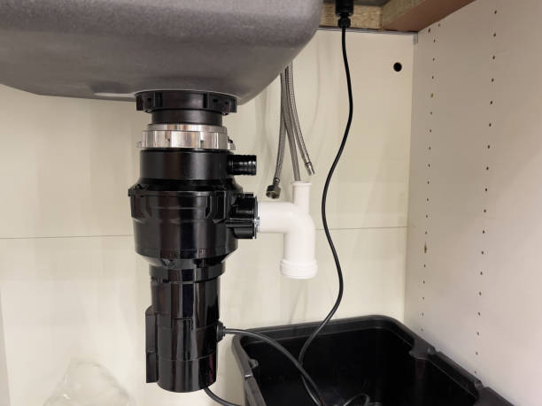 istock Kitchen sink interior and food waste shredder in a modern kitchen. 1829865879