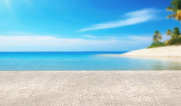 istock Concrete platform on blurred beach background. Mock up for product display. 1829875302
