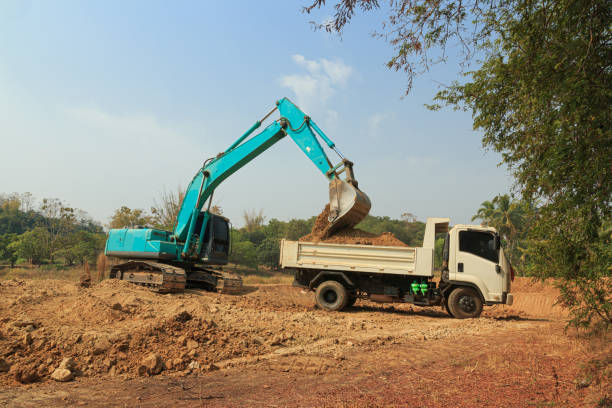 istock Crawler Excavator digging the soil into a truck 1829878078