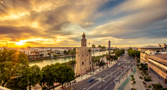 Photograph of the Torre del Oro at sunset, with the Guadalquivir River in the background.