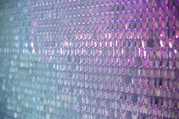 istock Abstract texture of pearl-colored sequins. 1829889599