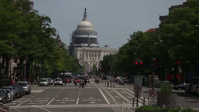 View of the Capitol Building in Washington DC, streets with lots of cars, USA