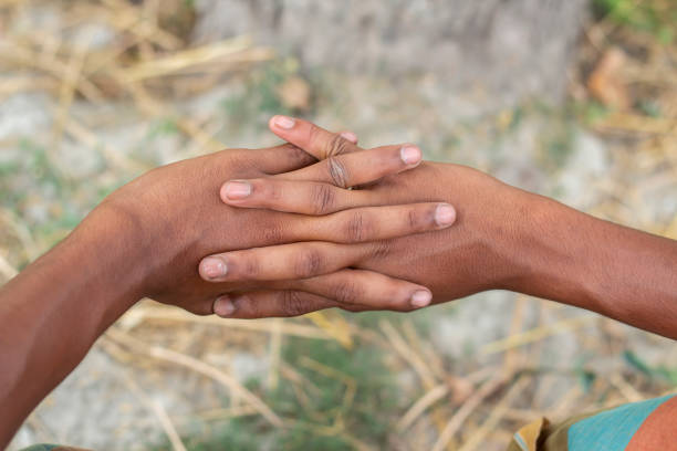 istock A man holding his hands together and blur background 1829915853