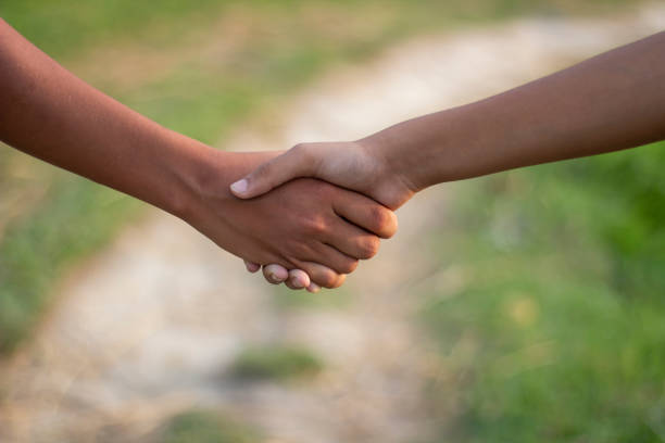 istock A man making handship with another man and blurred background 1829917464